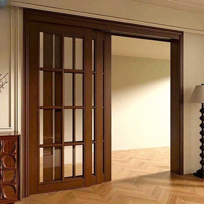 Puertas correderas a medida en Majadahonda de madera noble para separar despacho en casa y salón.